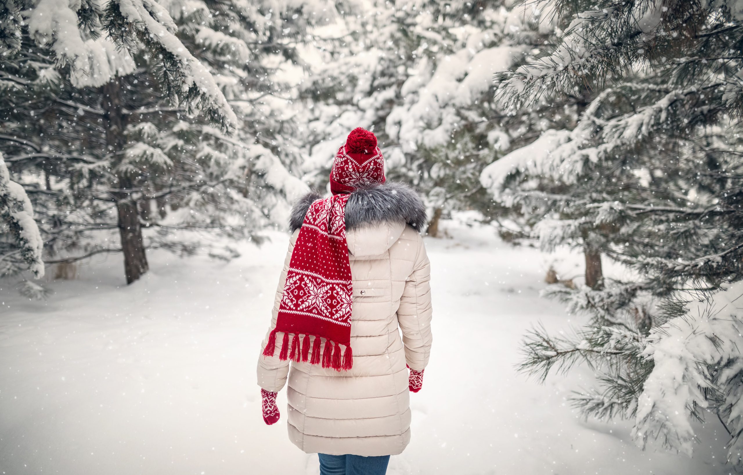 Woman in winter forest