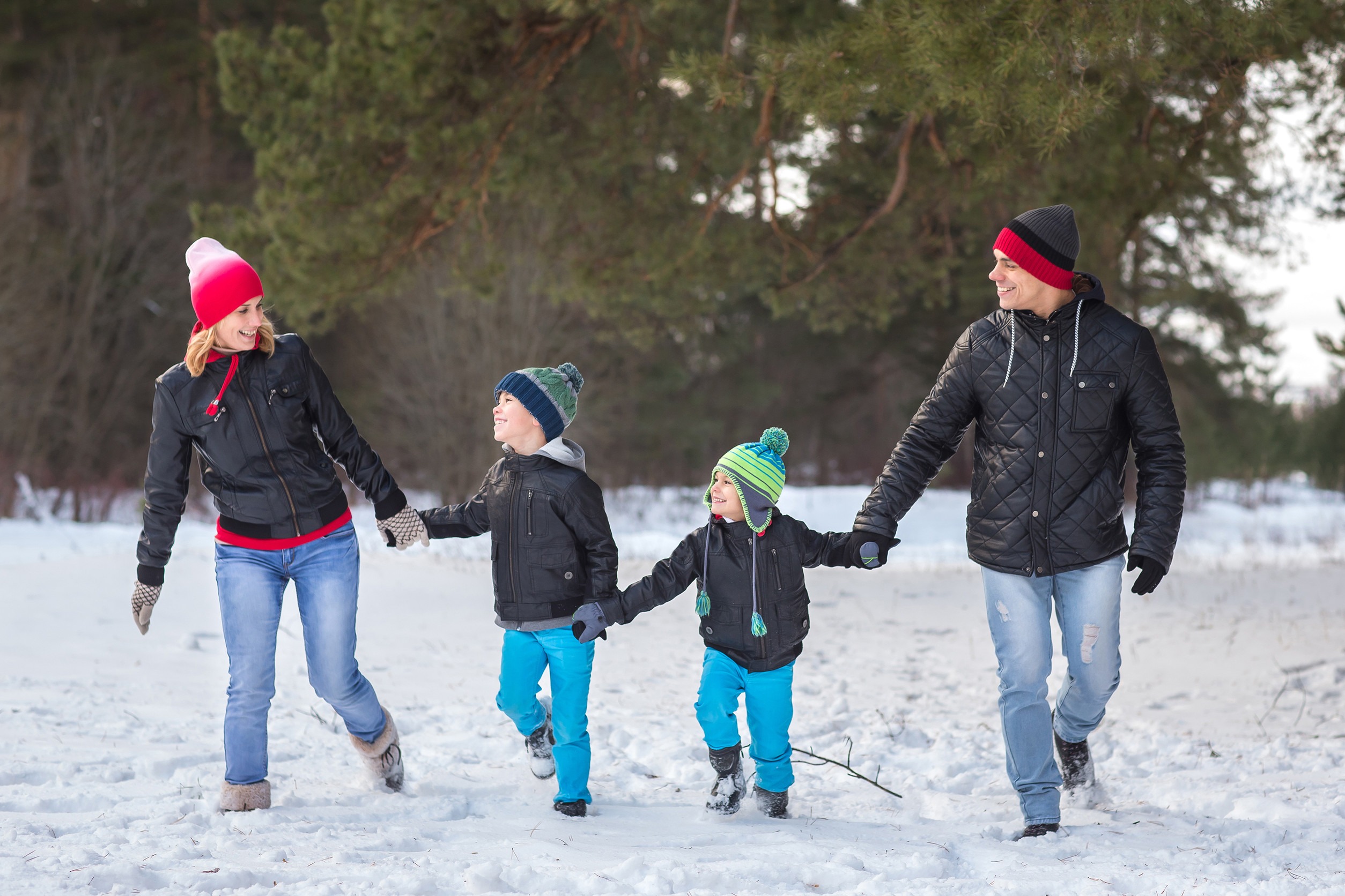 Happy family in the winter forest