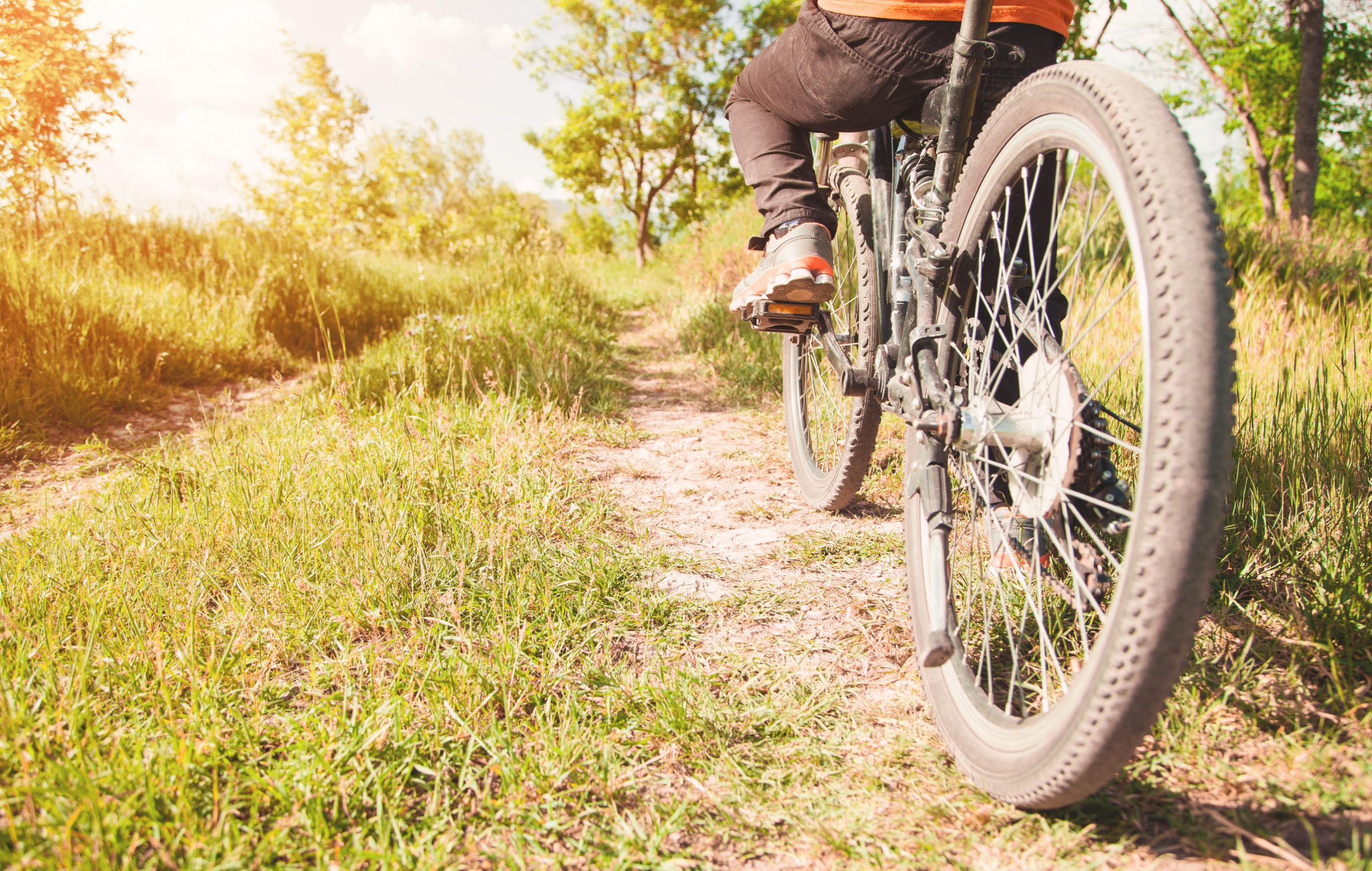 Caucasian boy with a bicycle in outdoors